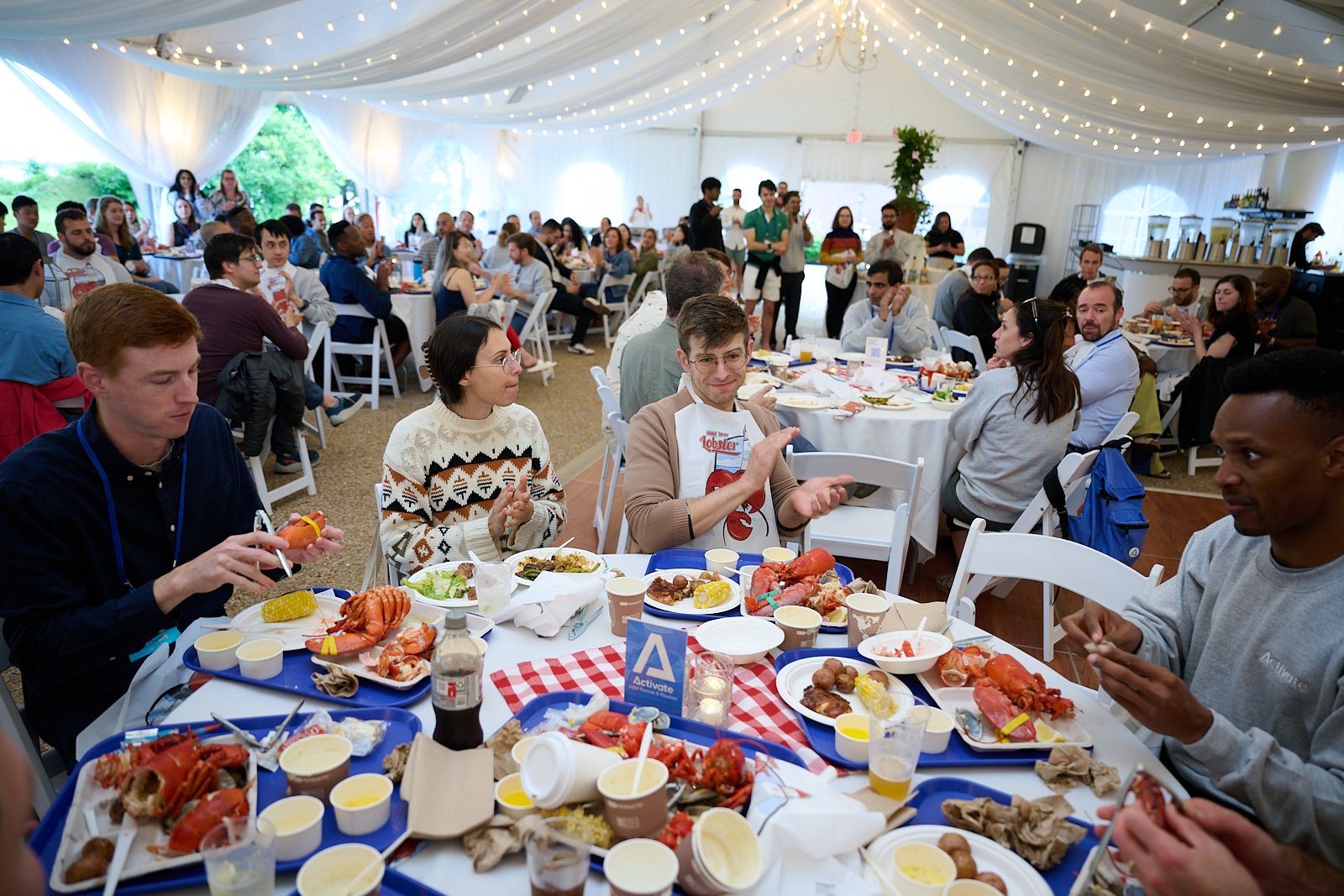  Activate Fellows eating dinner after concluding the second day of activities during the 2024 Activate Retreat 